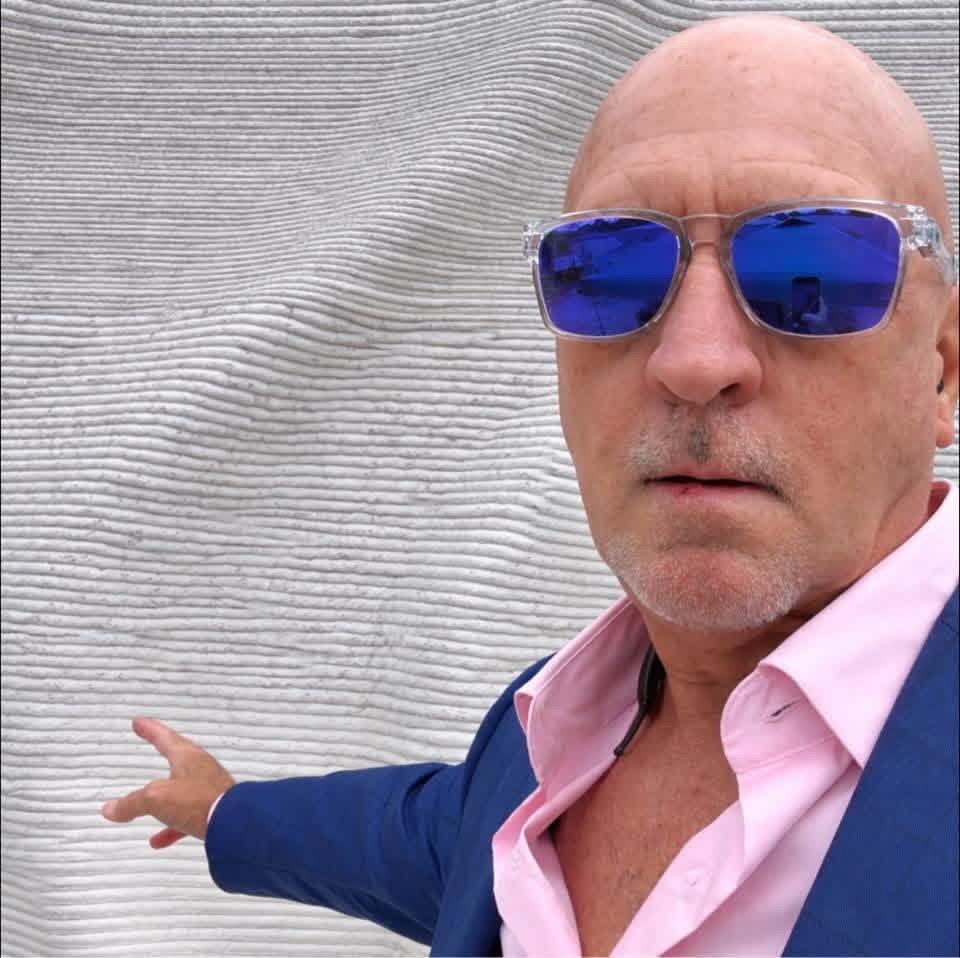 Daryl Snyder beside a textured 3D concrete printed wall